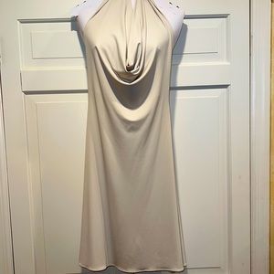 Classy and Sexy! Crème colored dress with haltered drape neck.
